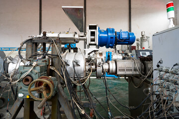 Industrial plastic extruder machine production line in factory setting