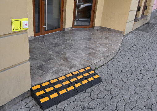 Ramp placed at building entrance for wheelchair access during the day