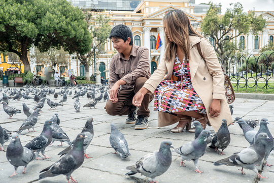 Two Latino friends on vacation in Plaza Murillo in La Paz, Bolivia - concept of life