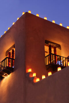 Santa Fe, New Mexico, United States. Tradional farolitos light up adobe structures.