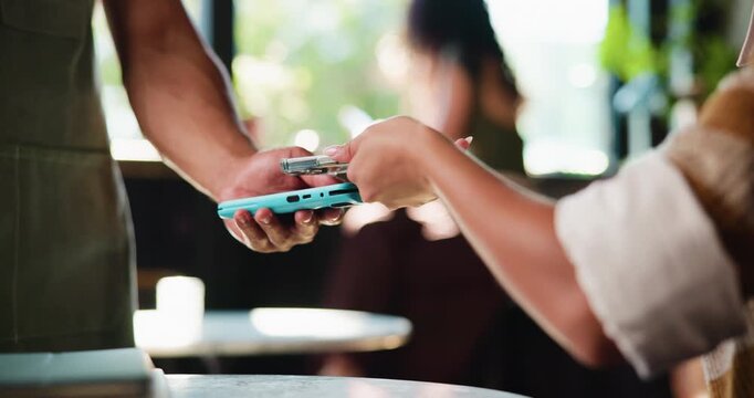 Payment, phone and hands in cafe with pos machine, eft service and transfer in cashless system. People, customer and waiter with tech, contactless and wireless transaction in electronic banking.
