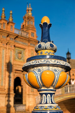 Seville, Spain. Plaza de Espagna, built in 1928 for the Ibero-American Exposition of 1929. Detail of  ceramic pot with plaza in background. 
