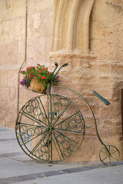 Cordoba, Spain Bicycle planter in front of old stone building