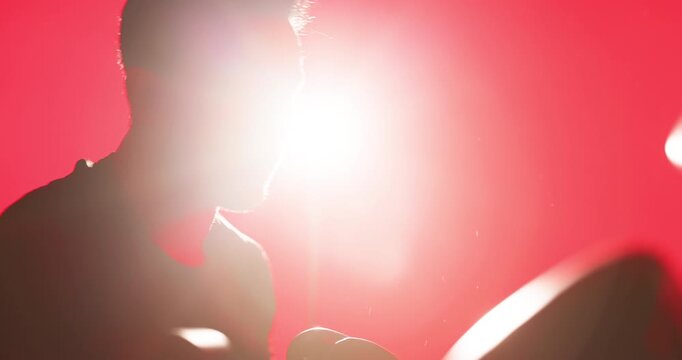 Man, boxing and workout in studio with coach for punching, power or coordination at fitness center. People, exercise and martial arts with cardio, strong or training with neon, flare and sport at gym