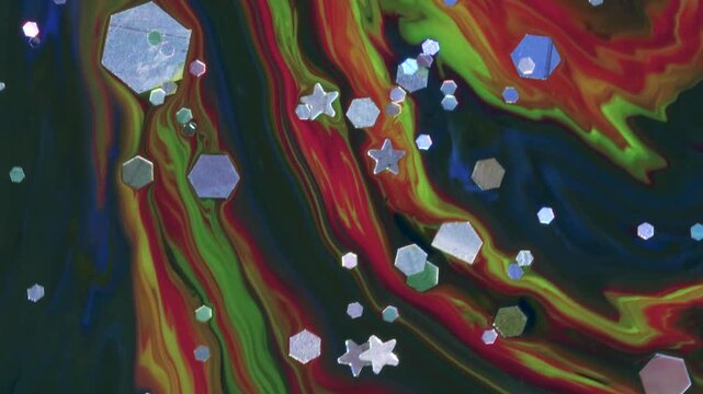 glittering stars and hexagons on rainbow fluid surface