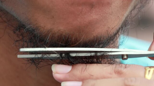 Trimming Beard with Scissors Extreme Close Up. Barber Cutting Beard Close Up Precision Shot