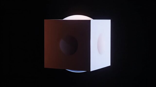 Abstract geometric shapes morphing rotating illuminated polyhedron cube sphere.