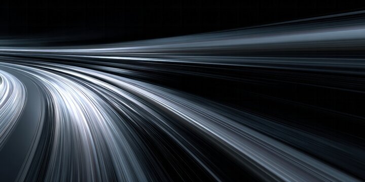 Abstract streaks of light suggest extreme velocity around a dark curve