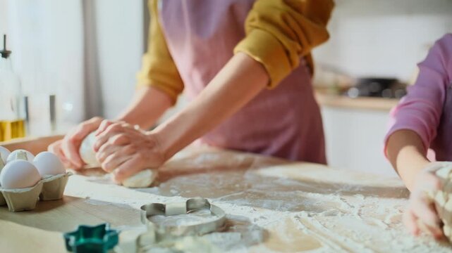 People hands making dough baking cuisine closeup. Smiling family preparing pie
