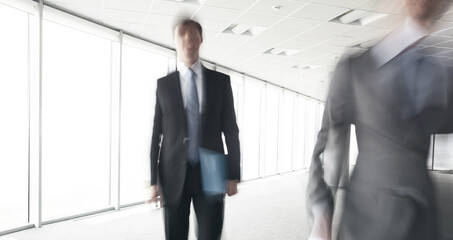 Fototapeta premium businessman in office blurred in motion