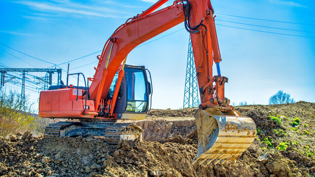 Construction site. Excavator dig the trenches. Trench for laying external sewer pipes