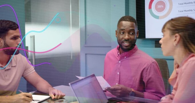 Presenter gesturing in business meeting team discussing data as animated graphs overlaying group