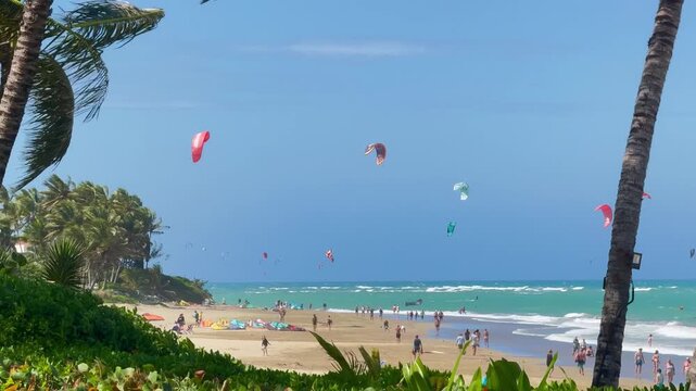 Kiteboarding kites fill the sky on Kite Beach, Cabarete, Dominican Republic