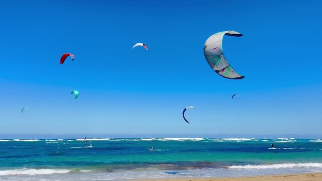 Kiteboarding kites fill the sky on Kite Beach, Cabarete, Dominican Republic