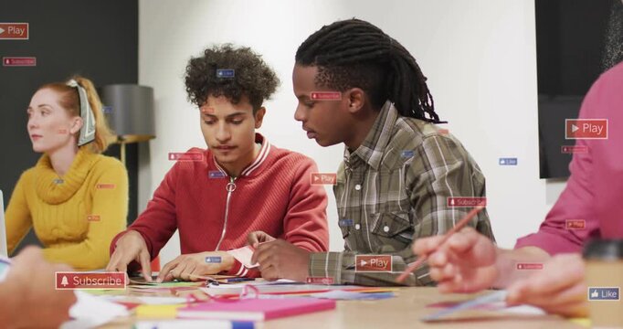 Man in plaid guiding man in red folding green paper, finalizing craft, UI appearing near hands