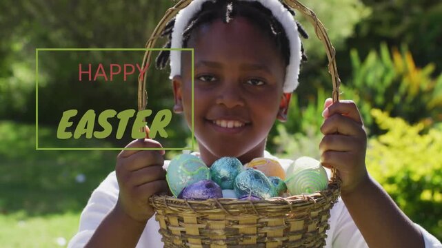 Boy holding basket, raising eggs to lens after HAPPY EASTER graphic appearing left for greeting