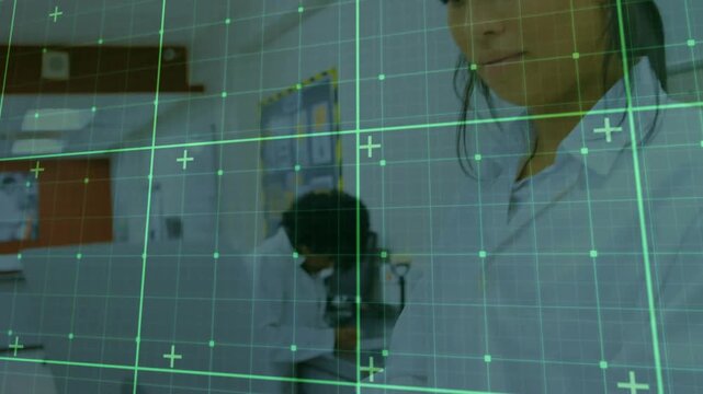 Green AR grid appearing, showing tech looking while lab tech handling purple cap tubes for research