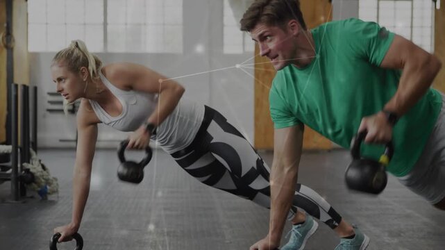Man and woman holding high plank then shifting into alternating kettlebell rows for fitness