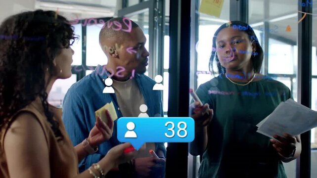 Vertical video: Marketing team pointing at glass, monitoring engagement while blue bubble appearing