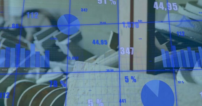 Camera panning right, closing on stacked parts in workshop, overlay updating bar charts for stock