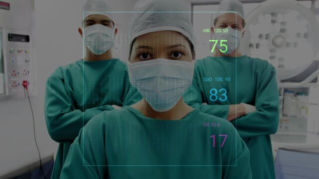 Vertical video: Cam pulling back, lead clinician standing while holo vitals pulsing for monitoring