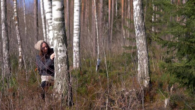 Woman Examining Birch Tree Bark in Spring Forest &mdash; Betula pendula, Chaga Foraging, Birch Sap, Wild Harvest, Forest Bathing, Boreal Birch Grove