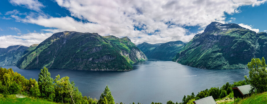 Woman at the viewpoint to Geirangerfjord at Hellesylt oin norway