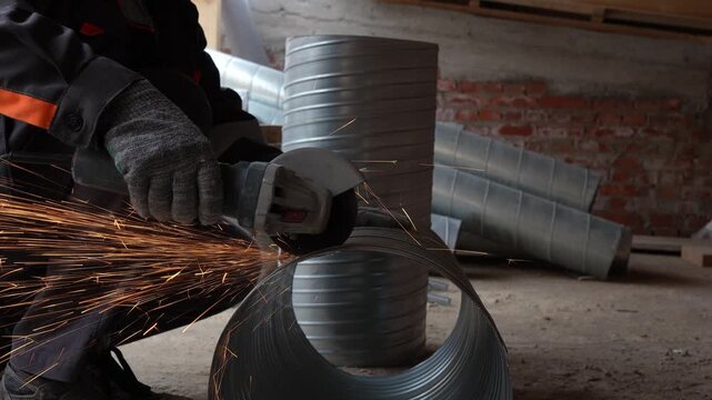 Professional HVAC technician cutting galvanized steel ductwork using a power tool