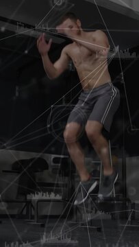 Man starting squat swing from box, doing plyo jumps with tuck for fitness, HUD tracking metrics