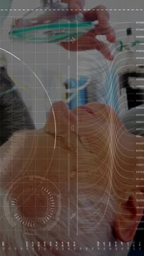 Vertical video: Medical caregiver bringing mask, aligning valve, sealing mask for bagging with HUD
