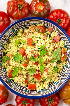 Tabbouleh o&nbsp;tabul&egrave; salad, Arab dish from the Middle East and Mediterranean, with parsley, bulgur, onions, mint, tomatoes, seasoned with lemon juice, olive oil