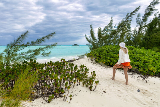 Woman with Jacket Gazing out along Coco Plum Beach