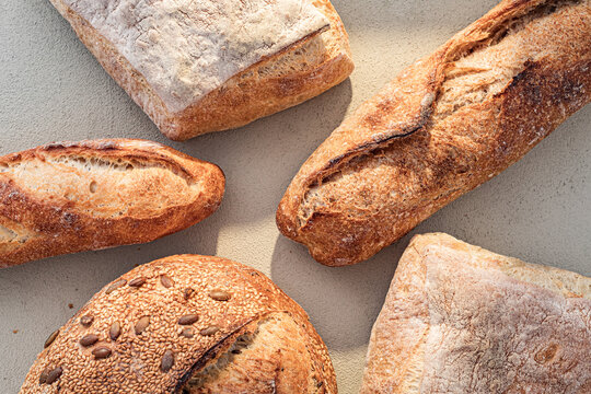 Assorted Artisan Bread on Rustic Concrete Background