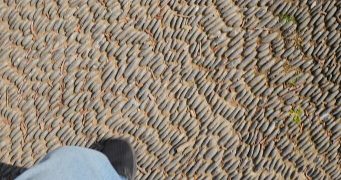 POV Shot of Feet Walking on Historical Cobblestone Street