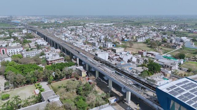 Aerial 4k view of RRTS Namo Bharat Train Running in Meerut, Uttar Pradesh, India