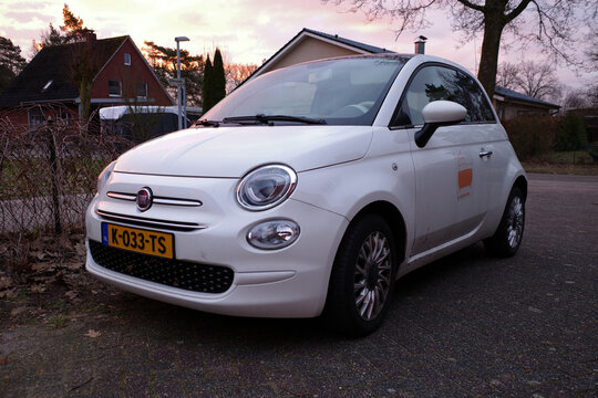 Itterbeck, Germany - Feb 20 2026 A white Fiat 500 with a Dutch yellow number plate is parked on a paved surface
