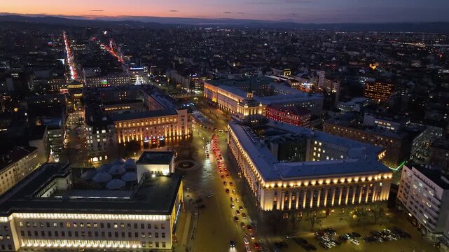 Night aerial view of the capital of Bulgaria, Sofia. Architectural and emblematic buildings from the communist era in the city center. Council of Ministers, Presidency and Party House. Sunset, sunrise