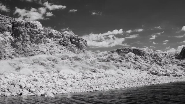 Cruise along Yardie Creek with river vegetation and rocks infrared dramatic view