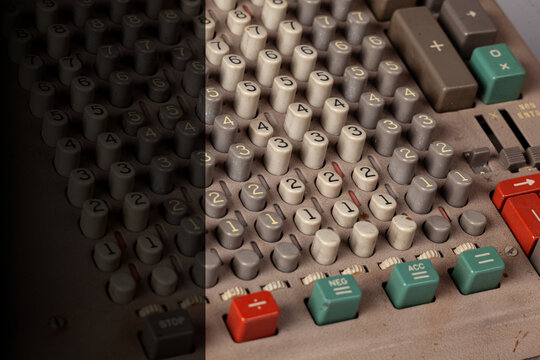 Vintage calculator keypad with numeric buttons, retro electronic device detail with light copy space on left side for text design -Serie VE05