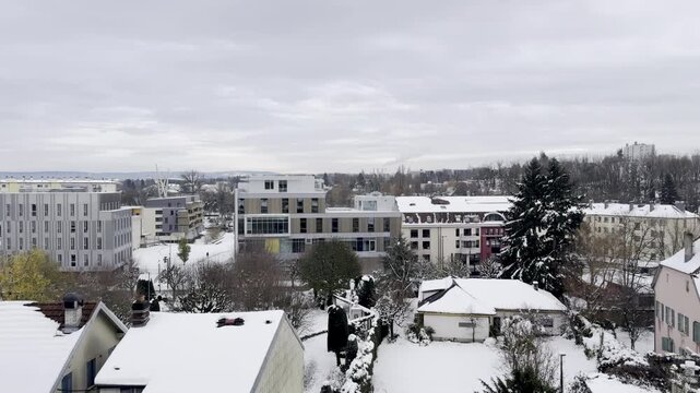 Montbeliard, France - November 23 2024: Winter viewpoints at the Acropole of Montbeliard Castle, with snow-covered sculptures, panoramic city views and a historic hilltop terrace