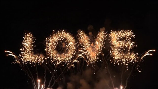 Fireworks Display Spelling Out the Word Love in the Night Sky.