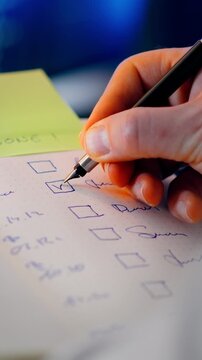 Checklist Closeup Pen Marking Task, handwritten planner details, checkbox selection, productivity concept, personal organization, schedule management, goal tracking, paper notes, office workflow