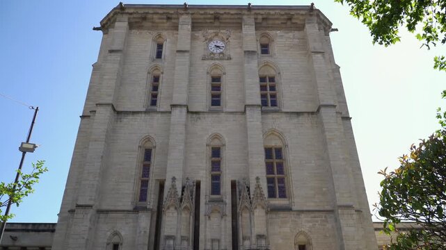 Historic Vincennes Castle gate tower with ancient clock, Paris, France.