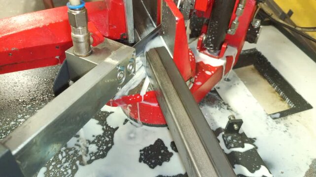 Rear view of full angle automatic profile cutting machine with industrial boron oil cooling system for metal fabrication