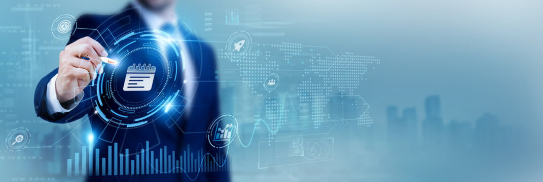 Business executive using a pen while analyzing data planning Agenda and strategic meeting planning, corporate organization, business management strategy, leadership planning
