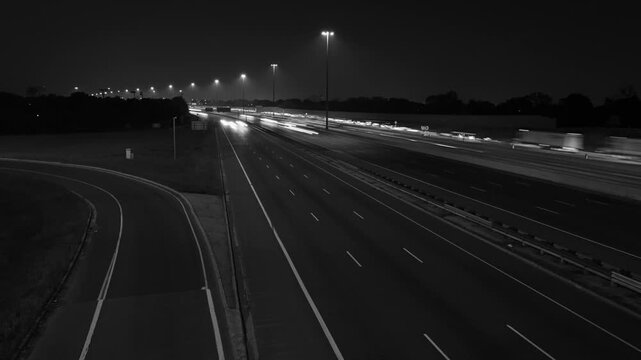 Highway 401 in Toronto. Time lapse of lanes at night. Black and white. HD video. 