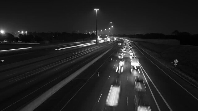 Highway 401 in Toronto. Time lapse of lanes at night. Fast & slow lanes. Black & white. HD video. 