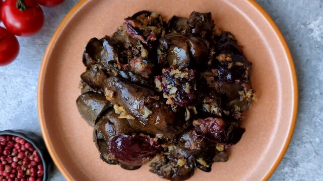 Chicken, duck, or goose liver with plums, onions, and spices. Chicken liver as a food background for your design
