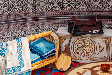 Obraz premium An Intimate Musical Rehearsal Featuring Dombra And Decorative Furnishings In Traditional Yurt