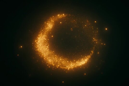 Glowing golden crescent shape with sparks on black background